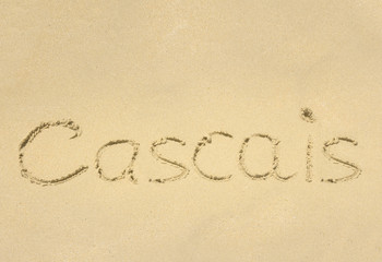 Inscription on wet sand Cascais. 