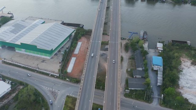 aerial photography sunset above Sri Surat bridge across Tapee river Surat Thani Thailand