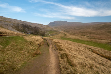 Fototapeta na wymiar Ingleborough (723 m or 2,372 ft) is the second-highest mountain in the Yorkshire Dales. It is one of the Yorkshire Three Peaks (the other two being Whernside and Pen-y-ghent).