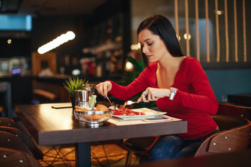 Young woman breakfast in a restaurant