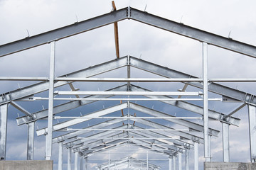 The structure of the building. Steel construction on the sky background. Electroplate steel metal. Zinc metal coating to protect against corrosion.