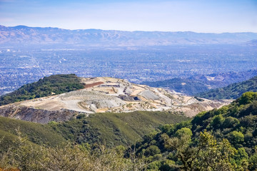 Fototapeta na wymiar Old deserted quarry in south San Francisco bay, San Jose in the background, California