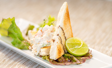 Seafood mayonnaise with toast, Appetizer. Fine Food set.