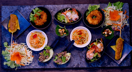 Fototapeta na wymiar Mixed Traditional Thaifoods on a Stoneplate, Fining Dining, Thailand