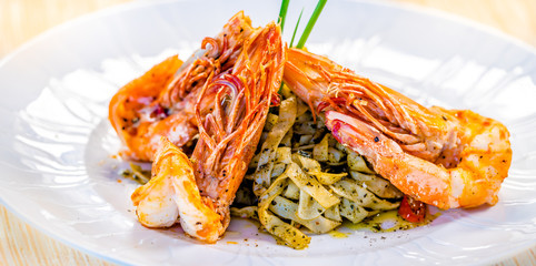 Fine dining organic food pasta with prawns and mussel seafood