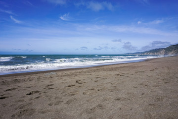 Fototapeta na wymiar Sandy beach on the Pacific Ocean coastline, California