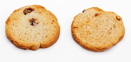 Mini round toasts of bread with raisins. 2 units. Isolated on white background.