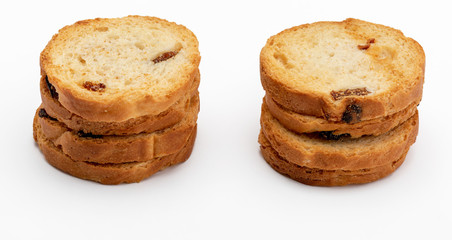 Fototapeta na wymiar Mini round toasts of bread with raisins. Several units. Isolated on white background.
