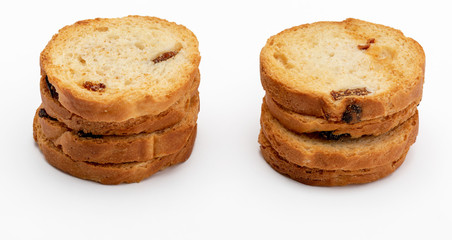 Mini round toasts of bread with raisins. Several units. Isolated on white background.