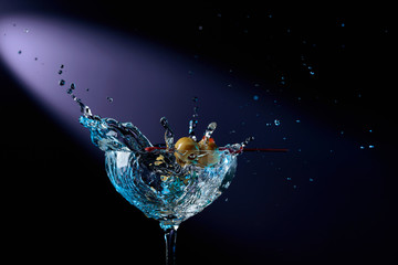 Dry martini with green olives.