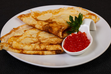 Pancake with red caviar