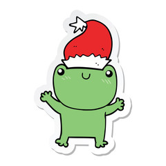 sticker of a cute cartoon frog wearing christmas hat
