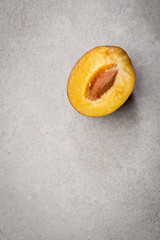 Half of fresh plum above