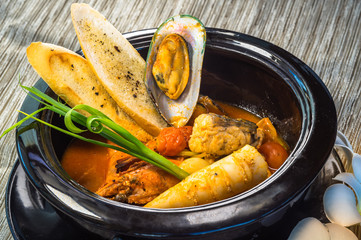 Spicy seafood Soup in a bowl, Thai style fine dining cuisine