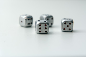 On a white background metal dice