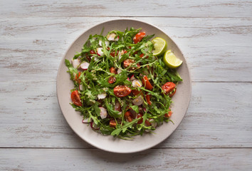 Organic salad with arugula and quinoa. Top view. 