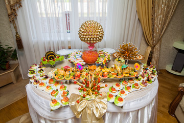 festively set table for buffet in the room