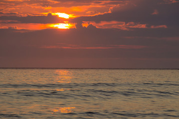 Fototapeta premium sunset on Unstad beach surrounded by mountains in Lofoten in Norway