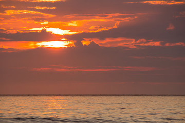 Fototapeta premium sunset on Unstad beach surrounded by mountains in Lofoten in Norway