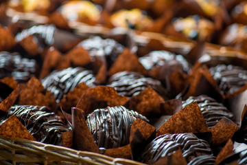 chocolate and berry cupcakes in a basket on the bakery window