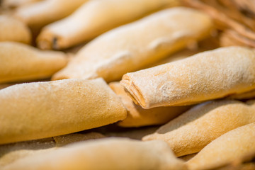 biscuits and pastries in the basket on the display of the bakery