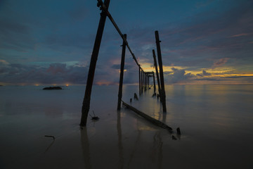 Beautiful sunset with old wooden bridge at Khao Pilai in Phang- Nga Province, Thailand