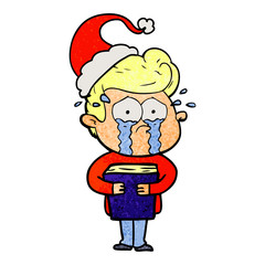 textured cartoon of a crying man holding book wearing santa hat