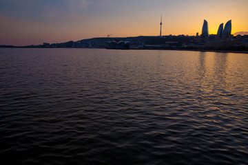 Naklejka premium Sunset of Baku, Azerbaijan . Fire towers in the night