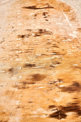 Brown colored background with lines and patches