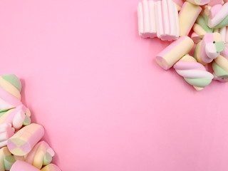 Fototapeta na wymiar Colorful MARSHMALLOWS on Pink Background