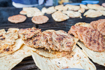 Tasty Grilled Burger And Chicken Meat On Barbecue Street Food