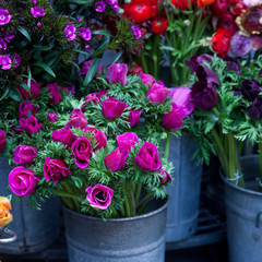 Anemones, ranunculus, and carnations in bouquets for sale