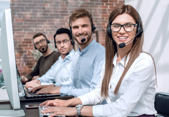 group of call center specialists work with clients