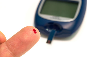 Fototapeta premium Drop of blood on the patient finger for make glucose level blood test.