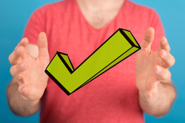 green checkmark in hand