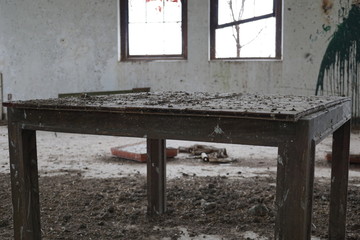 Table in an abandoned building