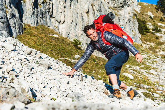 Man Mountain Hiking In Rocky Terrain