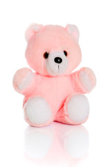 A cute pink teddy bear for a child to cuddle
