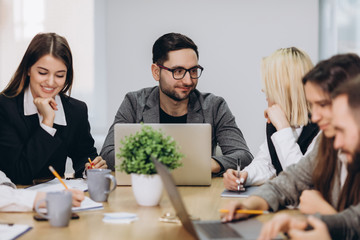 Professional team. Happy creative young people working in team while being at the office