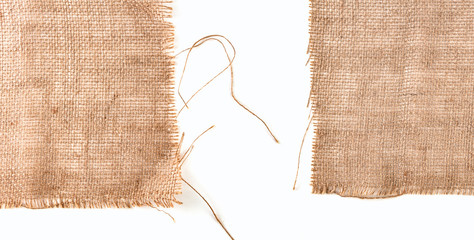 Clean sackcloth fabric worn edges, detail closeup on white background. - obrazy, fototapety, plakaty