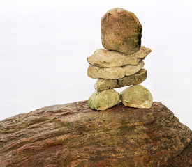 Stones balancing one upon another creating an Inukshuk