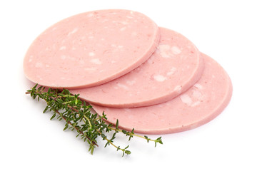 Boiled sausage slices with rosemary, close-up, isolated on white background