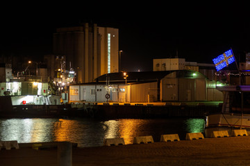 Industrial harbor in the evening with a ship and silo © Björn Kristersson