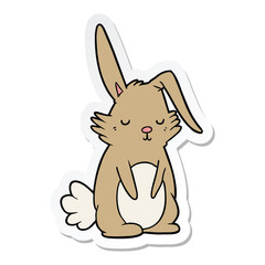 sticker of a cartoon sleepy rabbit