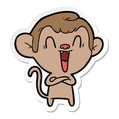 sticker of a cartoon laughing monkey