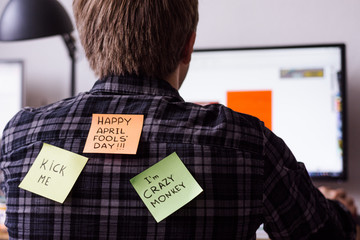 1 april fools day. Funny day. April fish. Prank. Inscriptions on the back. Stickers with jokes. Tric at work. Fun colleagues.Back with sticker