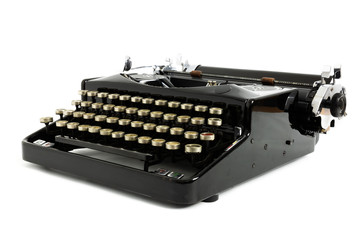 Old retro vintage typewriter in black color isolated on white background