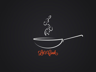 frying pan with food ingredients on black