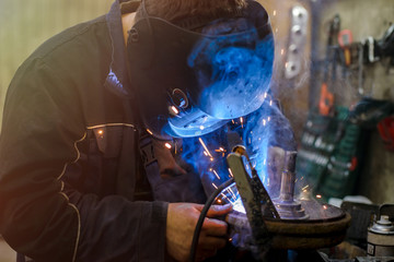 welder working at shallow depth of field