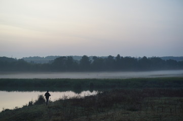 Obraz na płótnie Canvas Colourful sunrise with morning dew at a lake